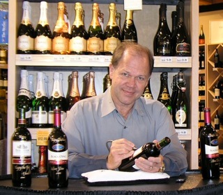 inscribing calligraphy on a wine bottle