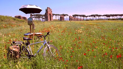 Kelly's bicycle waits while she paints a landscape