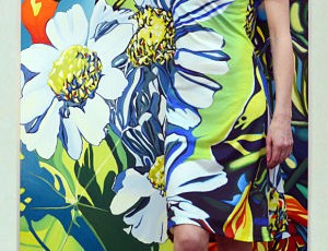 Artist Anne Gudrun in her "Daisy" dress with original painting
