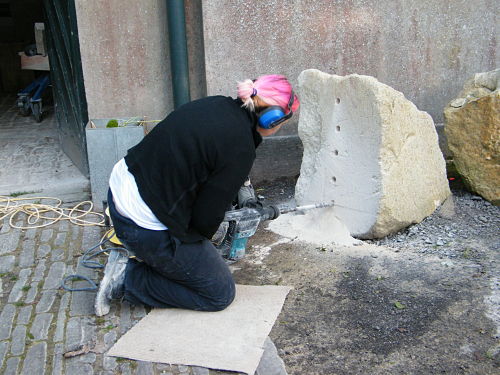 artist working on stone