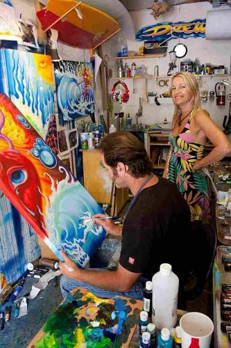 Maria Brophy and husband surf artist Drew Brophy in the studio. His work is extensively licensed. Photo Credit: David Macomber