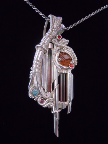 Sterling silver, fine silver, emerald, garnet, tourmalines, hessonite garnet, by artist Ben Harju