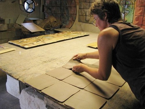 Brenda McMahon at work on a ceramic mural