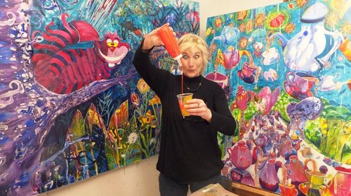 Artist Jen Stark with paintings