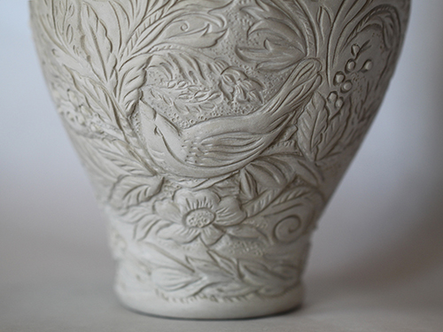 Intricately carved vessel in progress