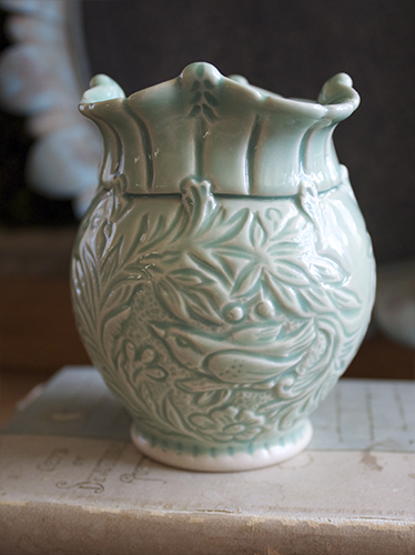 Carved, wheel-thrown porcelain vessel