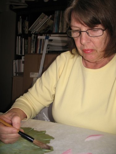 Artist Darlene Kaplan at work in her studio.