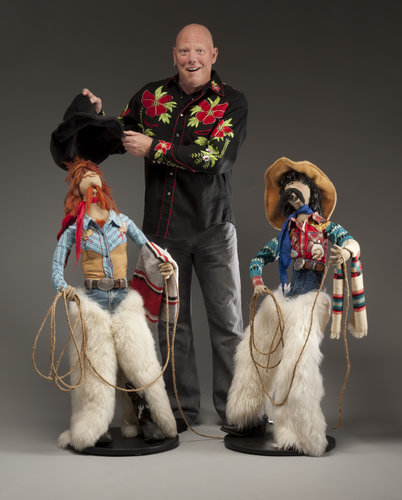 Artist Kent Epler shown with his sculptures titled "Cowboy Dudes". Read how he wholesale his work to galleries by visiting www.ArtsyShark.com