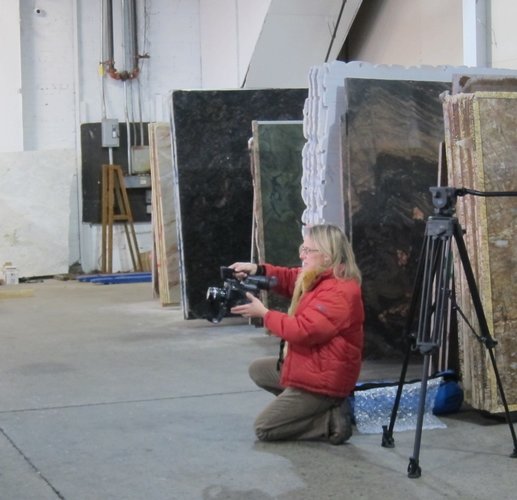 Catherine Stratton at work on a video shoot. Artist videos help introduce you to collectors. Read more at www.ArtsyShark.com