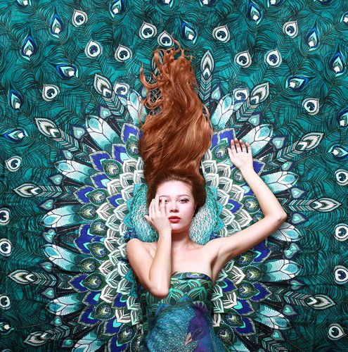 Roza Khaminova poses on one of her Peacock scarves. Read her story at www.ArtsyShark.com