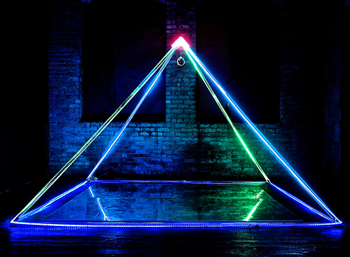 "Rainbow Pyramid" Acrylic Tubes, LED Light Strips, Copper Capstone, Mirror Floor. 10”H x 12”W x 12”D by artist Philip Noyed. See his innovative portfolio at www.ArtsyShark.com