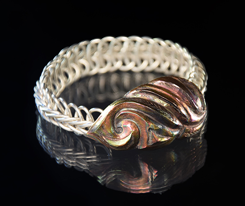 “Allahoudine VI” Sterling, Shakudo Bracelet, 8” x 7/8” x 3/8” by artist Victoria Lansford. See her portfolio by visiting www.ArtsyShark.com