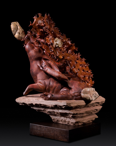 “Enfolded Cottontail” Redwood Burl on Sandstone, 18” x 18” x 14” by artist Ken Newman. See his portfolio by visiting www.ArtsyShark.com