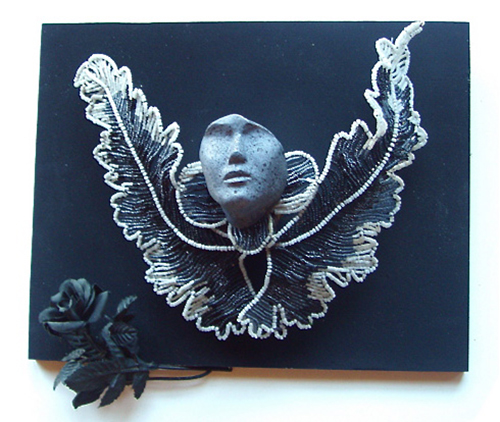 “Dark Angel” Mixed Media Assemblage, 12”W x 9”H x 5”D by artist Joan Hall. See her portfolio by visiting www.ArtsyShark.com