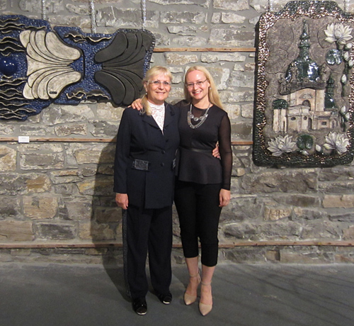 Artist Denisa Prochazka with her mother, Ludmila Prochazka, at her mother’s sculpture exhibition. See Denisa Prochazka's portfolio by visiting www.ArtsyShark.com