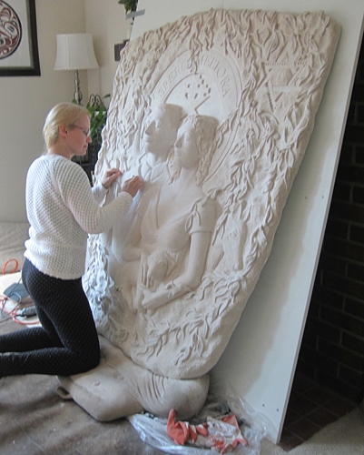 The artist Denisa Prochazka sculpting a commission work in her studio. See Denisa Prochazka's portfolio by visiting www.ArtsyShark.com