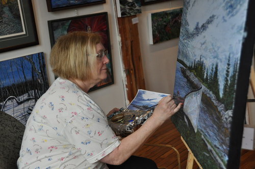 Artist Lynden Cowan in her studio. See her portfolio by visiting www.ArtsyShark.com