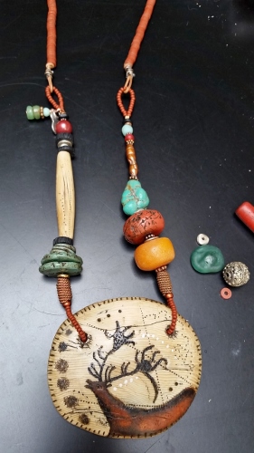 “Shaman Necklace: Red Deer Clan” Polymer Clay, Antique Trade Beads, Semi-Precious Stones, Medallion 3” x 4” by artist Luann Udell. See her portfolio by visiting www.ArtsyShark.com