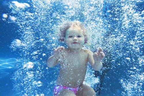 “Celestial Babies, Submerge I” Archival Photograph mounted on Plexiglas, ed. of 10, 30” x 45” by artist Cheryl Maeder. See her portfolio by visiting www.ArtsyShark.com