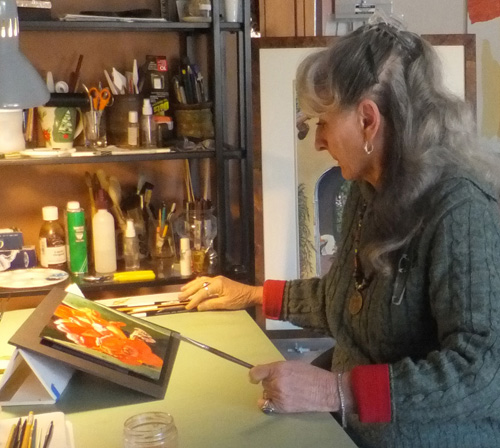 Artist Mary Dove in her studio. See her portfolio by visiting www.ArtsyShark.com