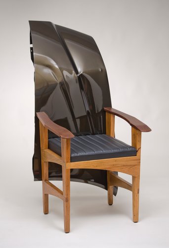 “Oasis for Coffee Sipping Intellectuals” high-backed chair, reclaimed chestnut, reclaimed walnut, vinyl seat, salvaged hood, 25” x 35” x 48” by David Lee Moneypenny. See his portfolio at www.ArtsyShark.com