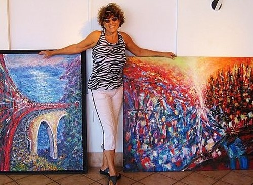 Artist Helen Kagan with her art at Miami Gallery. See her portfolio by visiting www.ArtsyShark.com