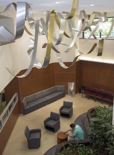 “Waves of Healing” 400 ft of Aluminum suspended with Monofilament in a 1,500 sq ft ceiling space by artist Richard Monteleone. See his portfolio by visiting www.ArtsyShark.com