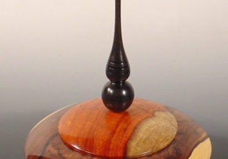 Lidded vessel made from Cocuswood, Narra, Gabony Ebony and Pink Ivory, 4 3/4" wide, 6 1/4" high, by Bryan Nelson. See his artist feature at www.ArtsyShark.com
