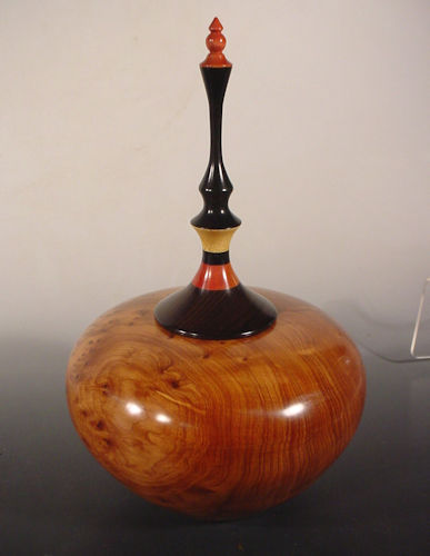 Lidded Hollow Vessel made from Thuya Burl, Gobon Ebony, Pink Ivory and Yellowheart, 6" wide x 7 3/4" high by Bryan Nelson. See his artist feature at www.ArtsyShark.com