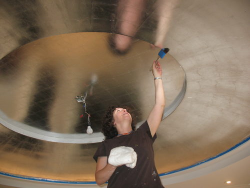 Artist Alise Loebelsohn at work silver leafing a ceiling. See her portfolio by visiting www.ArtsyShark.com