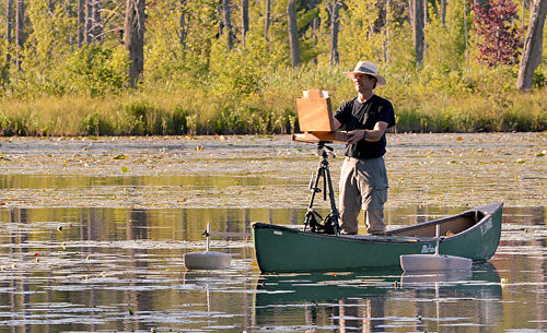 Artist Jeff Ripple painting from a canoe.See his portfolio by visiting www.ArtsyShark.com 