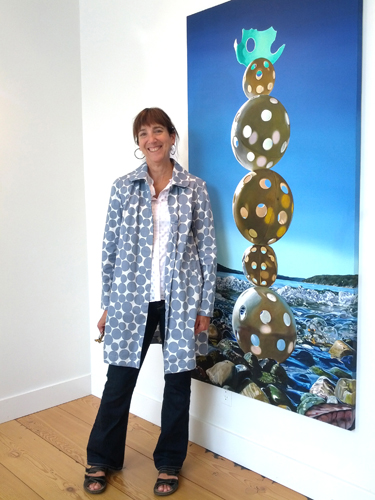 Artist Karen Hackenberg with “Inukshuk” Oil on Canvas, 36” x 72” by artist Karen Hackenberg. See her portfolio by visiting www.ArtsyShark.com