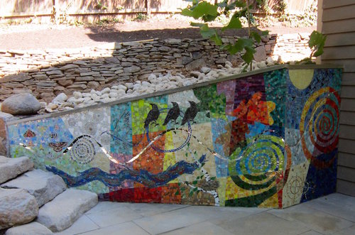 “Nature in Full Color” Mixed Material Mosaic on Retaining Wall, 12’ length x 22” to 56” highby artist Cynthia Fisher. See her portfolio by visiting www.ArtsyShark.com 