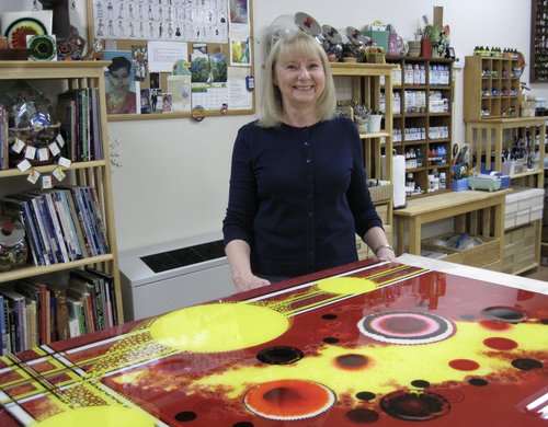 Artist Jeanne Rhea in her studio with a painting in progress.See her portfolio by visiting www.ArtsyShark.com 