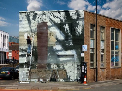 Want your artwork to appear as though it's on the side of a building? Read about the Photofunia app at www.ArtsyShark.com