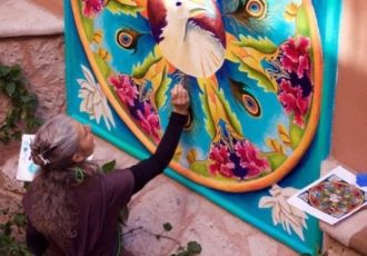 Artist Linda Laino at work on a mandala