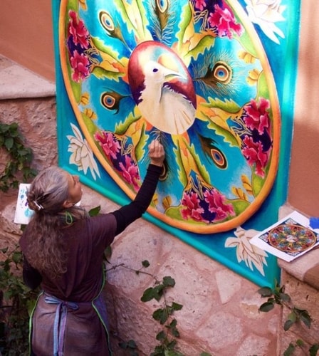 Artist Linda Laino at work on a mandala