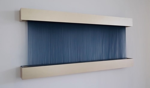 “Colorfall (Sea of Blue)” Sand, Sand Generating Apparatus, Silicone, Steel and Paint, 72” x 33” x 5.5” by artist Melissa Karine Jacobs. See her website by visiting www.ArtsyShark.com