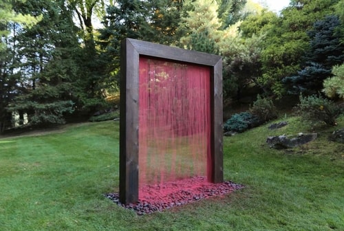 “Colorfall (Youth)” Sand, Sand Generating Apparatus, Rocks, Silicone, Wood and Cement, 68” x 84” x 7” by artist Melissa Karine Jacobs. See her website by visiting www.ArtsyShark.com