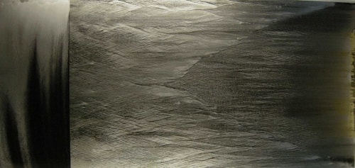 “Swathe” Metal Dust on Glass with Lacquer, 220cm x 107cm by artist James Robert White. See his portfolio by visiting www.ArtsyShark.com