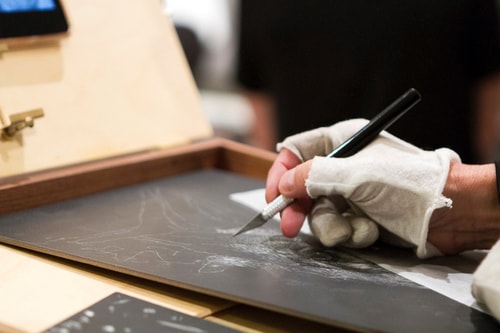 Artist Julie Chapman at work on a scratchboard demo using a #11 xacto knife. See her portfolio by visiting www.ArtsyShark.com