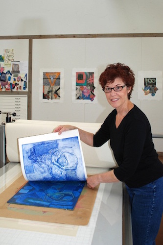 Artist Cecelia Feld in her studio working on a collagraph print.See her portfolio by visiting www.ArtsyShark.com 