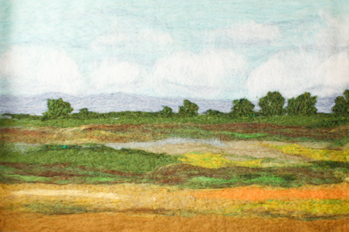 “Lowlands” Wool Fiber, 14” x 20” by artist Sarah Mandell. See her portfolio by visiting www.ArtsyShark.com