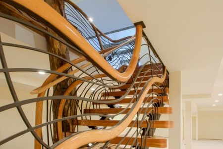 "The Tree House Stairway" (Private commission, North Chicago) Cherry Wood Treads and Balustrades, Metal, Whole Burr Oak Tree, 35' x 28' x 14'by artist Aaron Laux. See his portfolio by visiting www.ArtsyShark.com