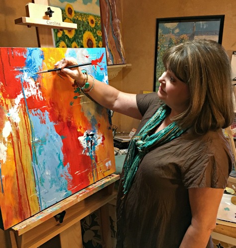 Artist Mary Mirabal in her studio. See her portfolio by visiting www.ArtsyShark.com
