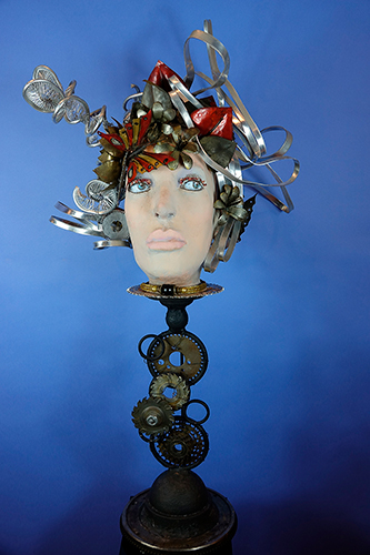“Edna” Mixed Media and Found Metals, 23” x 46” x 22” by artist Gail Glikmann. See her portfolio by visiting www.ArtsyShark.com