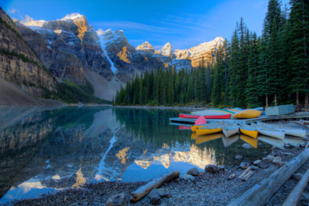 "Canoes at Moraine Lake in Banff National Park, Alberta, Canada" Photography, Various Sizes by artist Wayne Moran. See his portfolio by visiting www.ArtsyShark.com