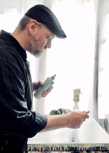 Artist Douglas Deveny working in his studio. by artist Douglas Deveny. See his portfolio by visiting www.ArtsyShark.com