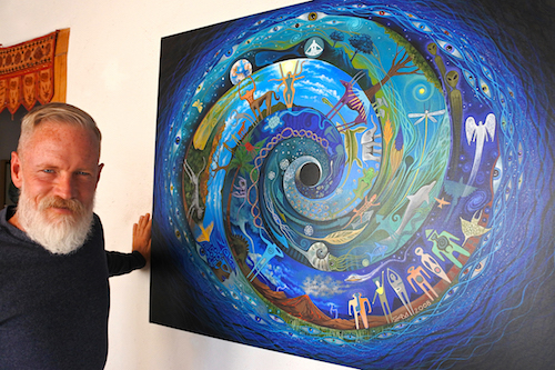 Artist Sam Brown with his archetypal painting “Spiral Speak” 