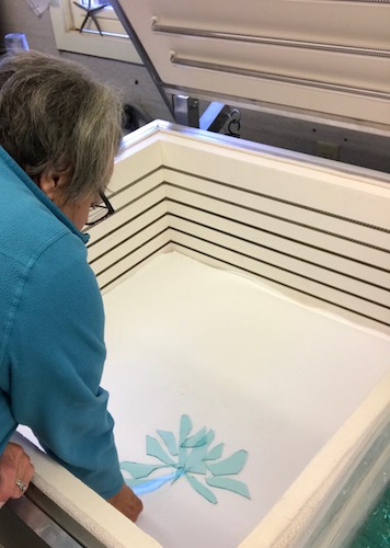 Artist Lori Schinelli creating the patterns of glass in her kiln. See her portfolio by visiting www.ArtsyShark.com